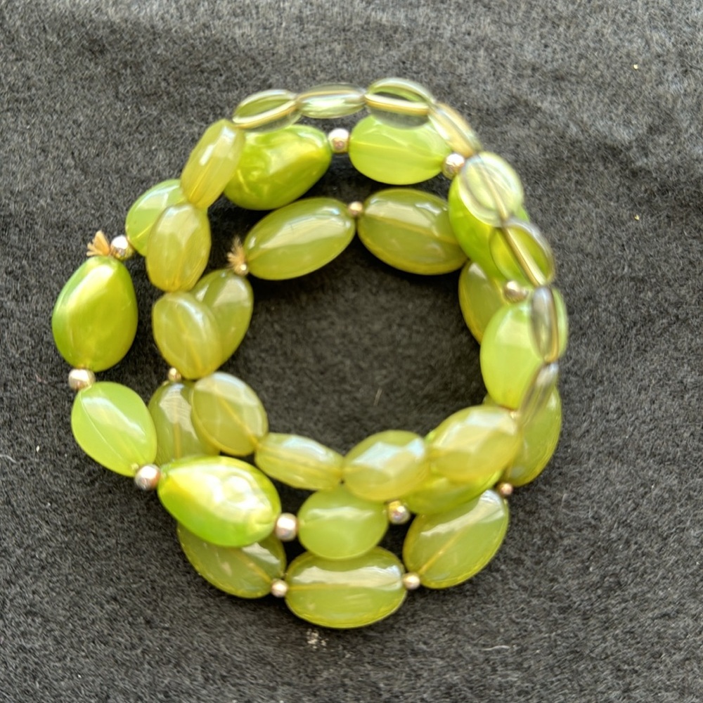 Green stone-like beaded bracelet bundle.